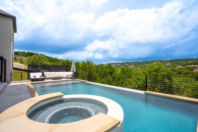 2220 Normandy Vw, Leander, TX 78641 - view of pool featuring a pool with connected hot tub, an outdoor living space, and a forest view