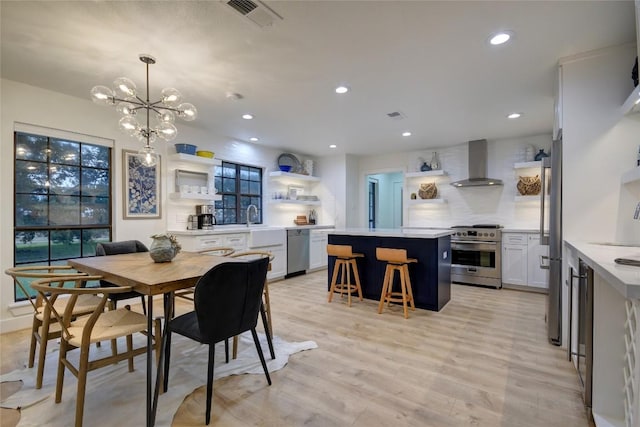 6569 Cutoff Rd, Round Top, TX 78940 - dining area featuring recessed lighting, a chandelier, and light wood-style floors