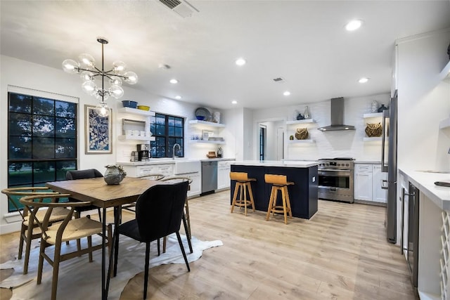 6569 Cutoff Rd, Round Top, TX 78940 - dining area featuring recessed lighting, a chandelier, and light wood-style flooring