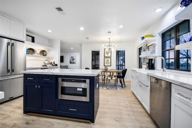 6569 Cutoff Rd, Round Top, TX 78940 - kitchen featuring stainless steel appliances, open shelves, white cabinets, a chandelier, and recessed lighting