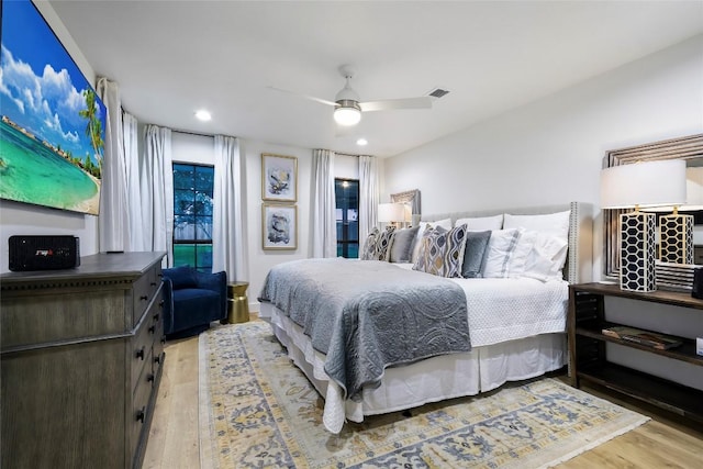 6569 Cutoff Rd, Round Top, TX 78940 - bedroom with wood finished floors, ceiling fan, and recessed lighting