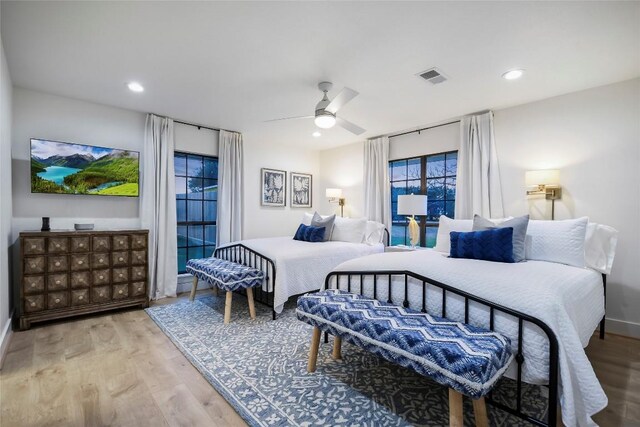 6569 Cutoff Rd, Round Top, TX 78940 - bedroom featuring wood finished floors, recessed lighting, and a ceiling fan