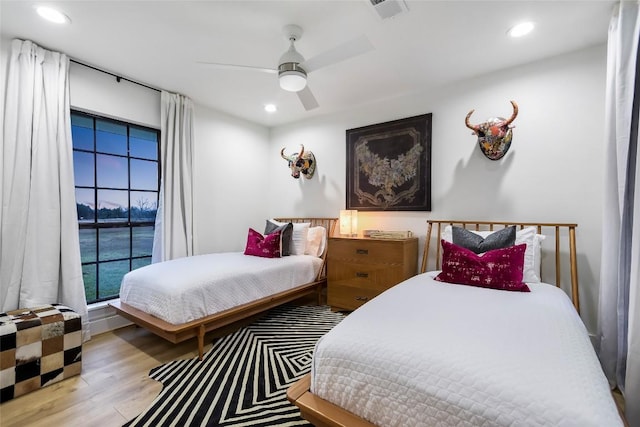 6569 Cutoff Rd, Round Top, TX 78940 - bedroom featuring wood finished floors, recessed lighting, and ceiling fan