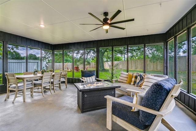 6569 Cutoff Rd, Round Top, TX 78940 - sunroom / solarium featuring ceiling fan, outdoor dining area, and an outdoor living space with a fire pit