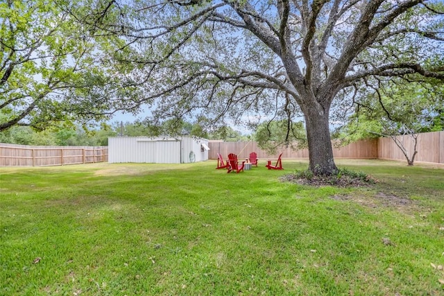 6569 Cutoff Rd, Round Top, TX 78940 - fenced backyard with an outbuilding and a pole building