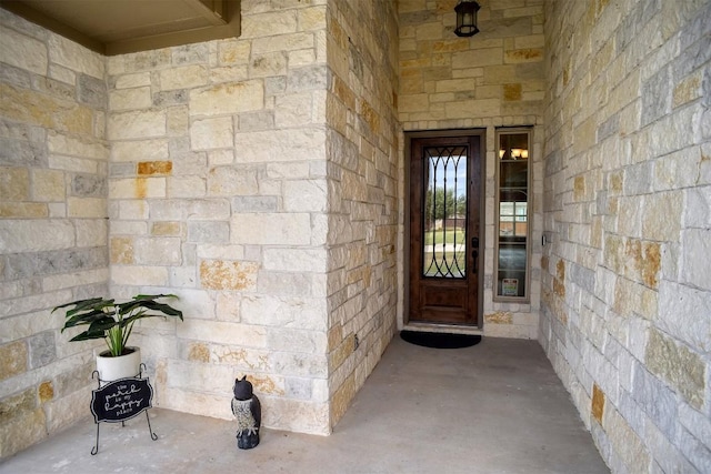 285 Chisholm Trl, Bastrop, TX 78602 - property entrance with stone siding