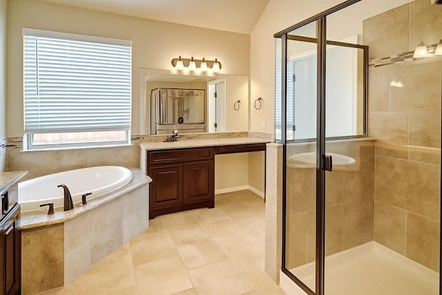 285 Chisholm Trl, Bastrop, TX 78602 - full bathroom featuring vanity, a bath, a stall shower, and lofted ceiling