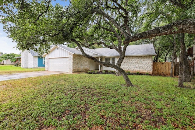 1808 Fawn Ridge Trl, Round Rock, TX 78681 - mid-century inspired home with stone siding, concrete driveway, a garage, and board and batten siding