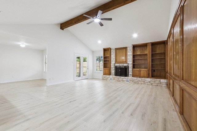 1808 Fawn Ridge Trl, Round Rock, TX 78681 - unfurnished living room with beam ceiling, light wood finished floors, a ceiling fan, a fireplace, and high vaulted ceiling