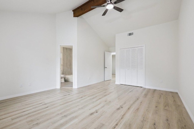 1808 Fawn Ridge Trl, Round Rock, TX 78681 - unfurnished bedroom featuring beamed ceiling, a closet, light wood-style floors, high vaulted ceiling, and connected bathroom