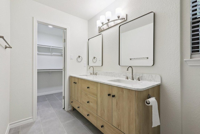 1808 Fawn Ridge Trl, Round Rock, TX 78681 - full bath with double vanity, tile patterned flooring, and a walk in closet