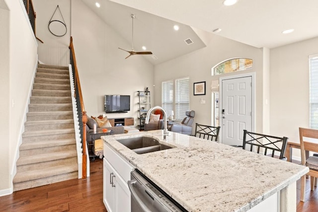 11400 W Parmer Ln Unit 75, Cedar Park, TX 78613 - kitchen with dishwasher, white cabinets, recessed lighting, open floor plan, and dark wood-style floors