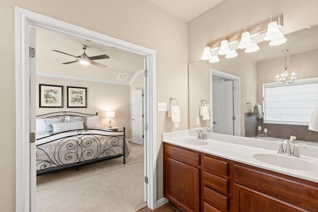 11400 W Parmer Ln Unit 75, Cedar Park, TX 78613 - full bathroom featuring double vanity, a ceiling fan, ornamental molding, and a chandelier