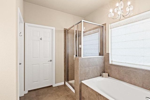 11400 W Parmer Ln Unit 75, Cedar Park, TX 78613 - bathroom with a shower stall, a bath, and a chandelier