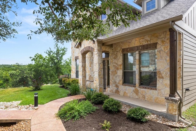 11400 W Parmer Ln Unit 75, Cedar Park, TX 78613 - entrance to property featuring stone siding, a yard, and a shingled roof