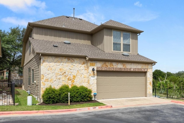 11400 W Parmer Ln Unit 75, Cedar Park, TX 78613 - view of front of property featuring stone siding, an attached garage, concrete driveway, and a shingled roof