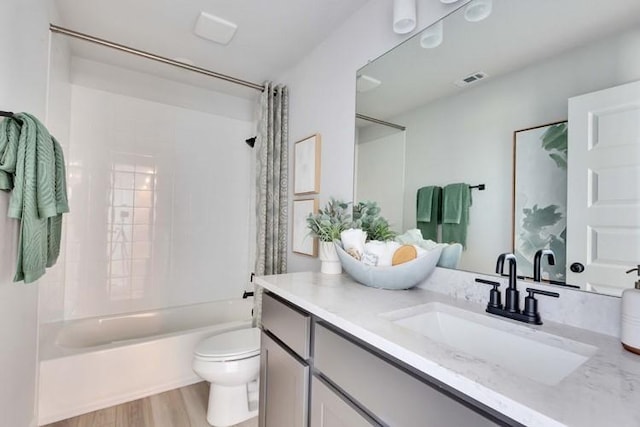 2235 Oscar Eli Way, Round Rock, TX 78665 - bathroom featuring vanity, shower / bathtub combination with curtain, and wood finished floors