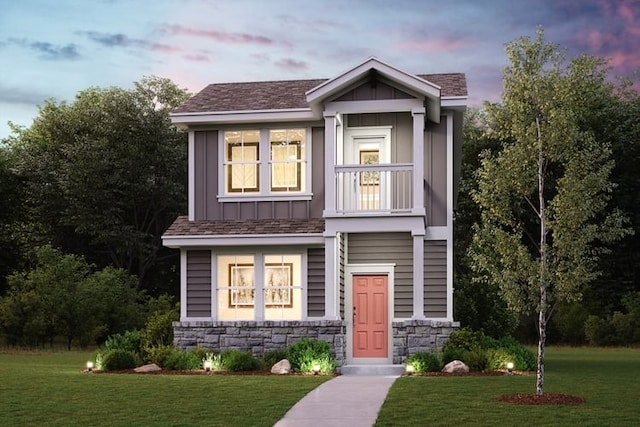 2231 Oscar Eli Pl, Round Rock, TX 78665 - view of front of home featuring board and batten siding, a lawn, and stone siding
