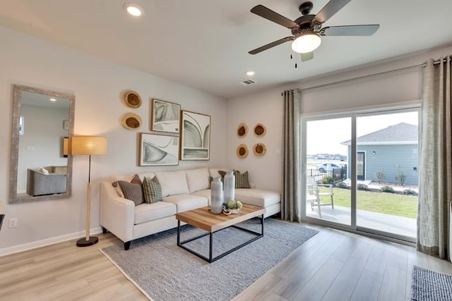 2231 Oscar Eli Pl, Round Rock, TX 78665 - living area featuring light wood finished floors, a ceiling fan, and recessed lighting