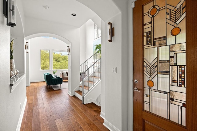 8540 Adirondack Trl Unit 21, Austin, TX 78759 - foyer entrance featuring hardwood / wood-style flooring, stairway, and arched walkways
