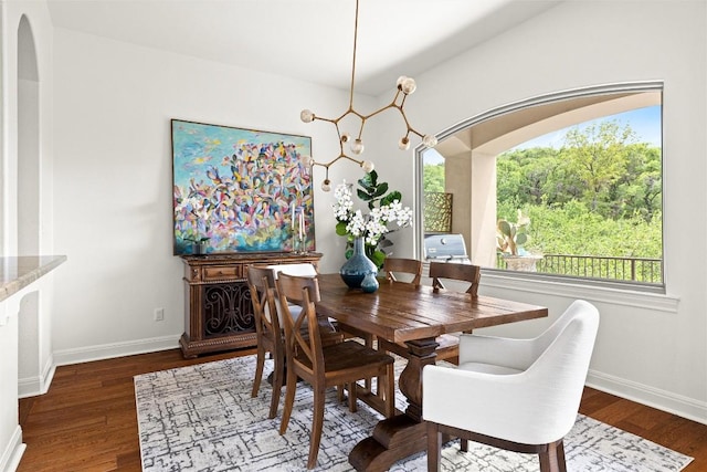 8540 Adirondack Trl Unit 21, Austin, TX 78759 - dining space featuring wood finished floors, healthy amount of natural light, a chandelier, and arched walkways