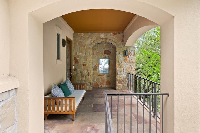8540 Adirondack Trl Unit 21, Austin, TX 78759 - entrance to property featuring stone siding, stucco siding, and a balcony