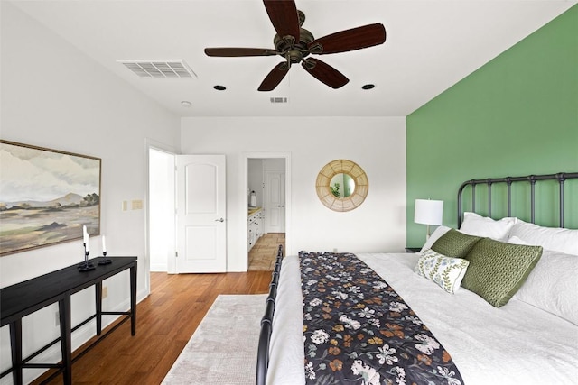 8540 Adirondack Trl Unit 21, Austin, TX 78759 - bedroom with wood finished floors and a ceiling fan