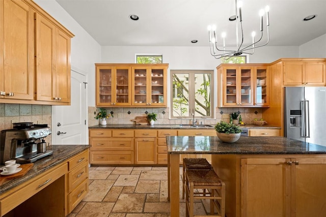 8540 Adirondack Trl Unit 21, Austin, TX 78759 - kitchen featuring high quality fridge, tasteful backsplash, glass insert cabinets, and recessed lighting