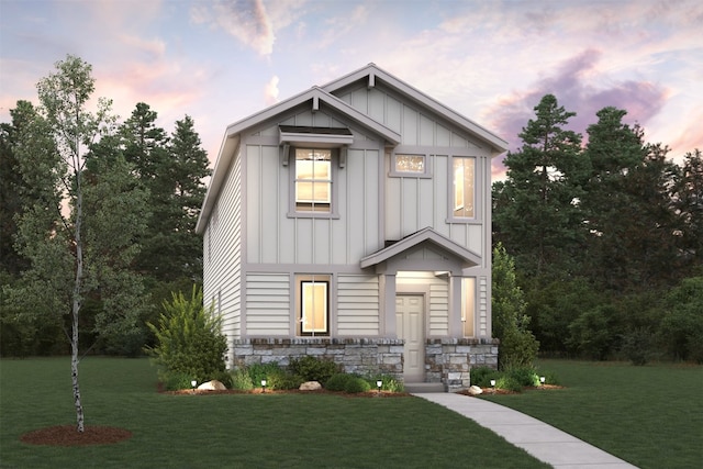 2022 Alice Jay Way, Round Rock, TX 78665 - view of front of property with board and batten siding, a lawn, and stone siding