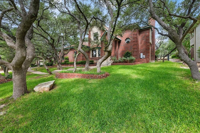 125 Long Wood Ave, Lakeway, TX 78734 - view of front of home with a front lawn and brick siding