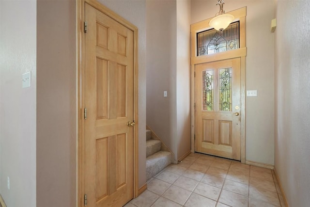 125 Long Wood Ave, Lakeway, TX 78734 - foyer entrance featuring light tile patterned floors and stairway