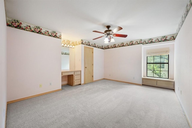 125 Long Wood Ave, Lakeway, TX 78734 - unfurnished room featuring light carpet, ceiling fan, and an office area