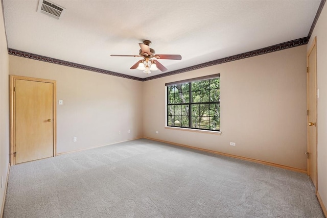125 Long Wood Ave, Lakeway, TX 78734 - empty room with crown molding, carpet, and a ceiling fan