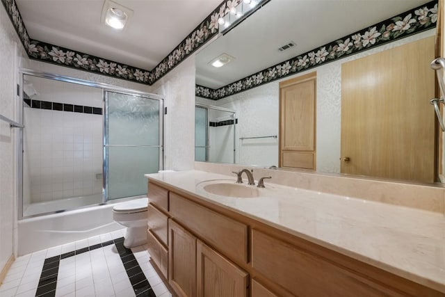 125 Long Wood Ave, Lakeway, TX 78734 - full bathroom featuring tile patterned flooring, shower / bath combination with glass door, and vanity