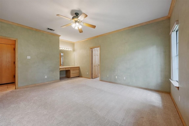 125 Long Wood Ave, Lakeway, TX 78734 - unfurnished bedroom featuring carpet floors, built in study area, ornamental molding, and a ceiling fan
