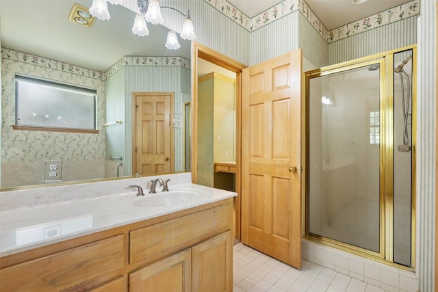 125 Long Wood Ave, Lakeway, TX 78734 - bathroom with wallpapered walls, tile patterned flooring, a shower stall, and vanity