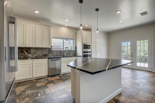 309 Camperdown Elm Dr, Austin, TX 78748 - kitchen with stainless steel appliances, dark countertops, healthy amount of natural light, and recessed lighting