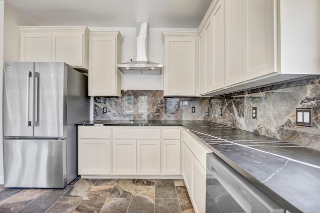 309 Camperdown Elm Dr, Austin, TX 78748 - kitchen featuring appliances with stainless steel finishes, wall chimney exhaust hood, decorative backsplash, dark countertops, and stone finish floors
