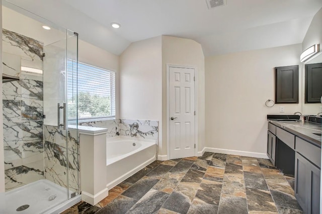 309 Camperdown Elm Dr, Austin, TX 78748 - bathroom with a garden tub, a marble finish shower, vanity, lofted ceiling, and stone tile flooring