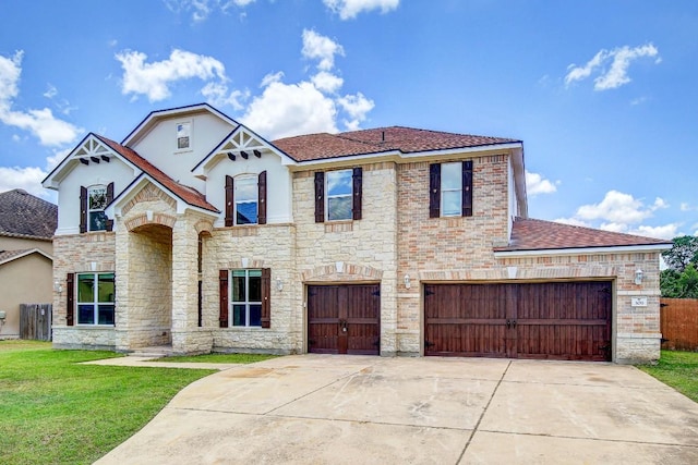309 Camperdown Elm Dr, Austin, TX 78748 - view of front of property featuring stone siding, driveway, an attached garage, stucco siding, and a shingled roof