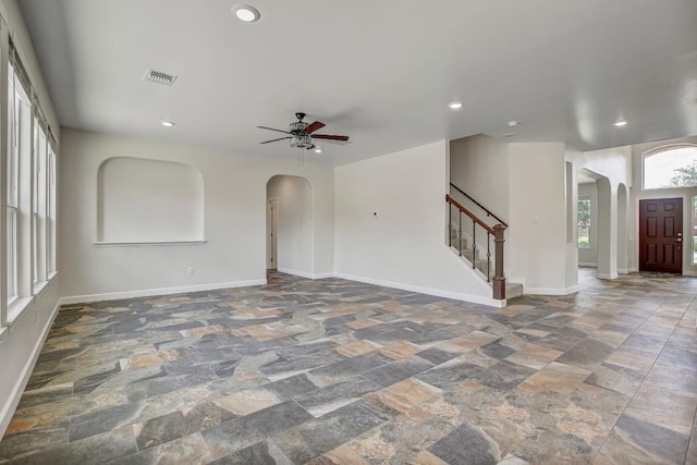 309 Camperdown Elm Dr, Austin, TX 78748 - foyer with arched walkways, stone tile floors, a ceiling fan, and recessed lighting