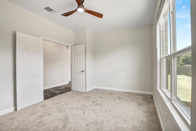 309 Camperdown Elm Dr, Austin, TX 78748 - unfurnished bedroom featuring carpet, multiple windows, and a ceiling fan
