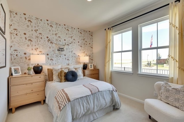 2420 Ekvall Dr, Round Rock, TX 78665 - bedroom with light carpet, multiple windows, and wallpapered walls
