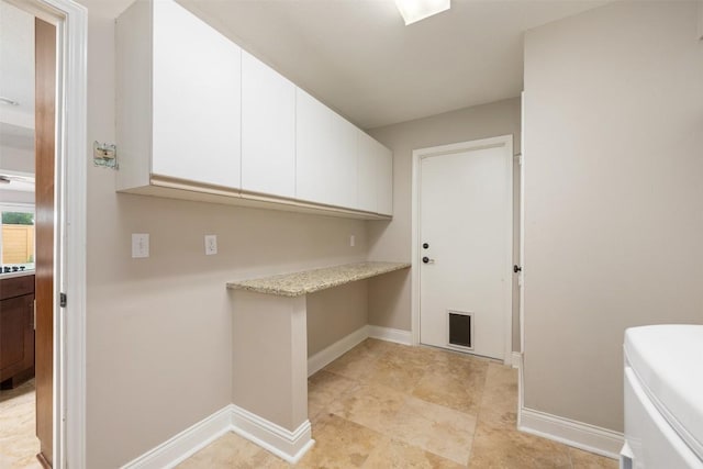 315 Comet, Lakeway, TX 78734 - washroom featuring baseboards and cabinet space