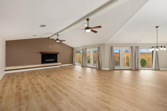315 Comet, Lakeway, TX 78734 - unfurnished living room featuring a ceiling fan, a fireplace with raised hearth, and light wood-type flooring
