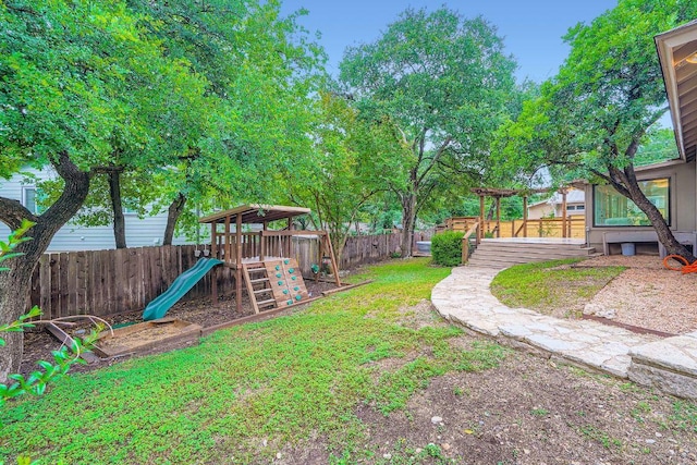 3501 Fleetwood Dr, Austin, TX 78704 - fenced backyard featuring a playground