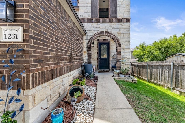 1231 Tumbleweed Trl, Temple, TX 76502 - property entrance featuring stone siding and brick siding