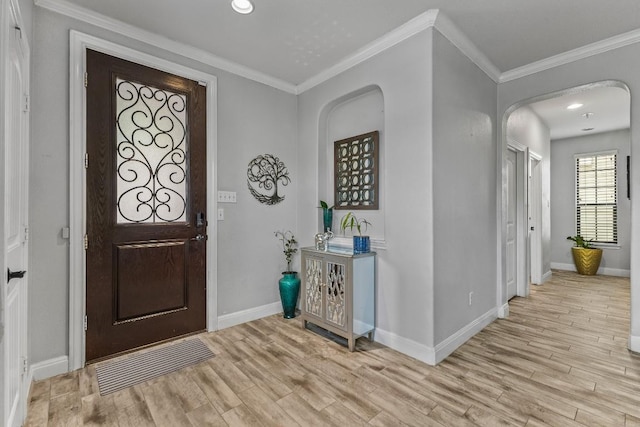 1231 Tumbleweed Trl, Temple, TX 76502 - foyer entrance with wood finished floors, arched walkways, crown molding, and recessed lighting