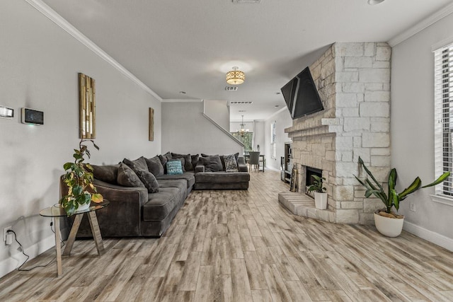 1231 Tumbleweed Trl, Temple, TX 76502 - living area featuring wood finished floors, ornamental molding, healthy amount of natural light, and a chandelier