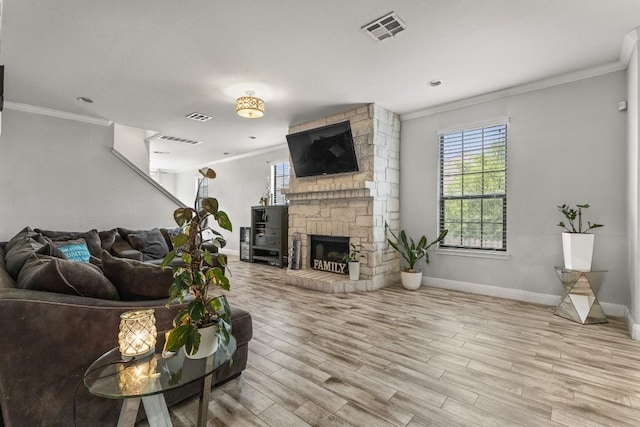 1231 Tumbleweed Trl, Temple, TX 76502 - living room with crown molding, wood finished floors, and a stone fireplace